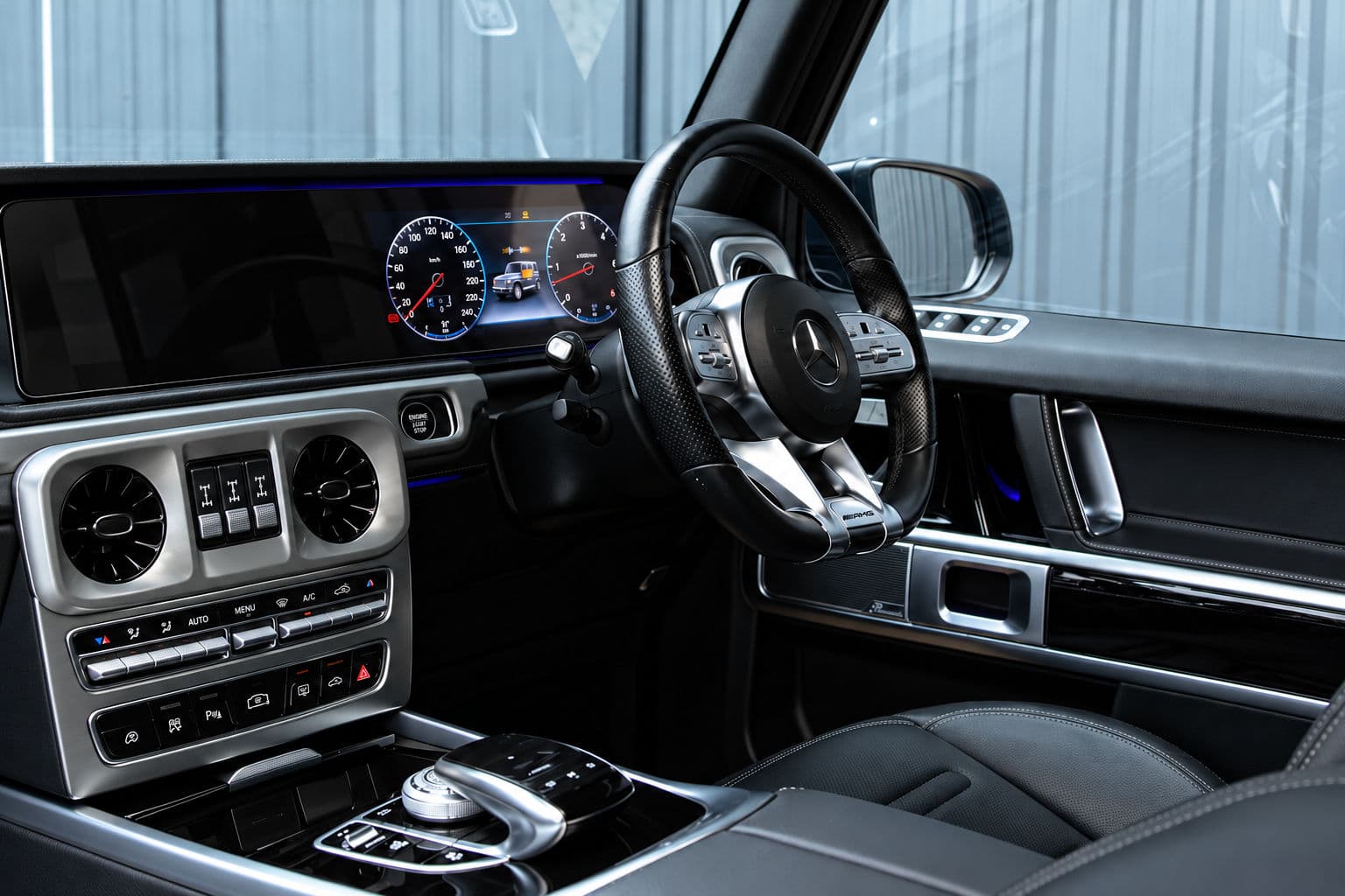 G350: Mercedes-Benz G350 2022 black leather interior, right-hand-drive cockpit with digital instrument cluster and steering wheel